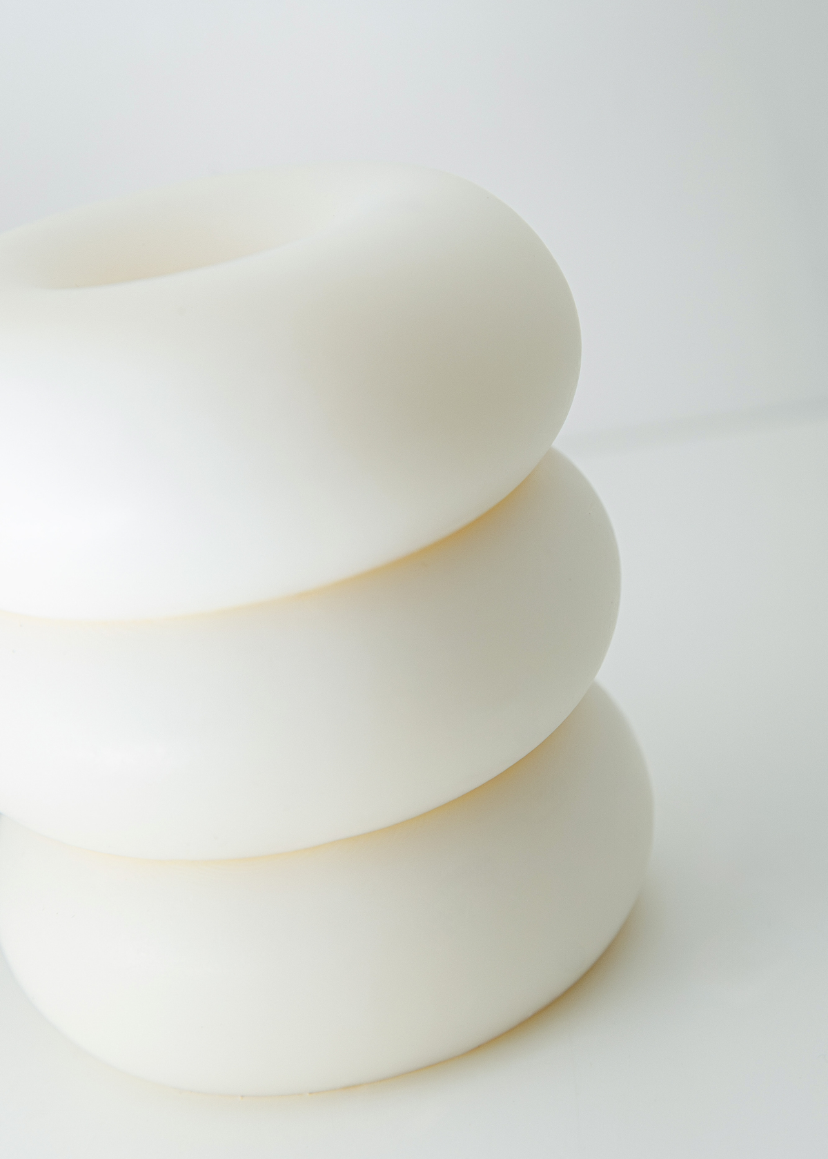 Armonia white soy coconut wax candle with smooth wax texture and three wick openings
