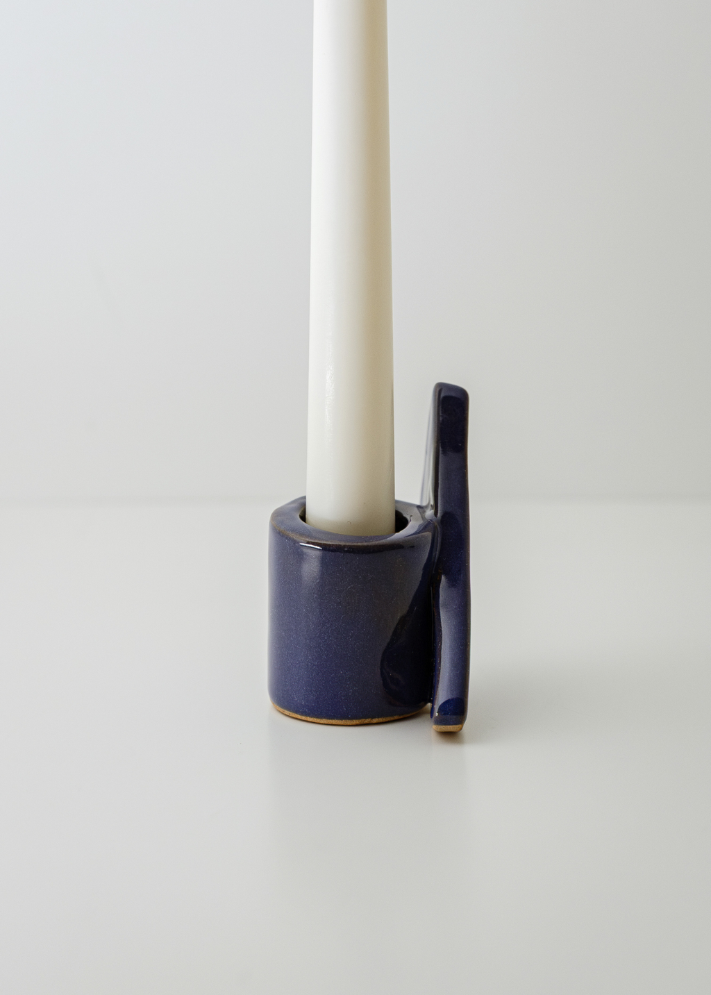 From Light to Table ceramic candle holder set with taper candles, textured irregular surface in blue
