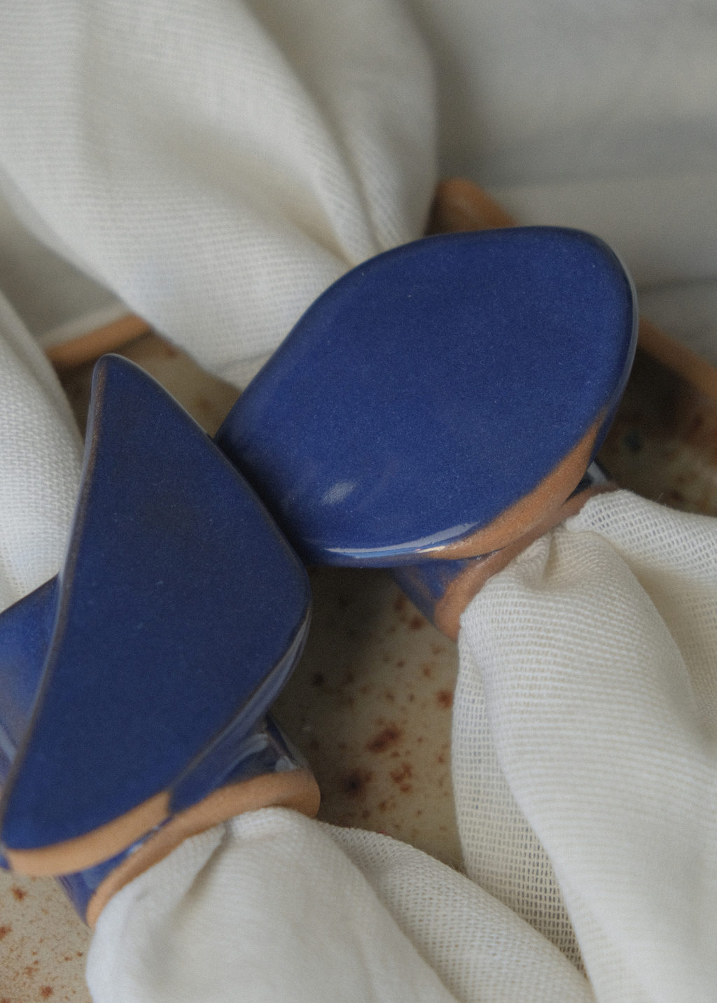 From Light to Table handmade ceramic candle holder set with taper candle, textured irregular blue finish