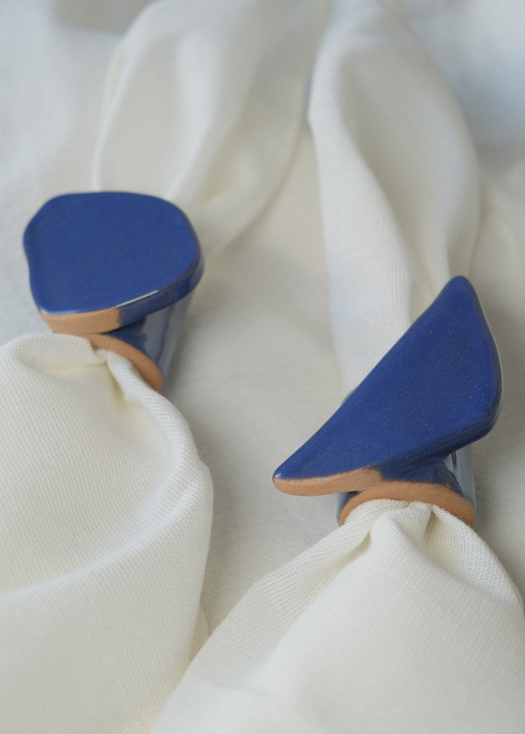 From Light to Table handmade ceramic candle holder set with taper candle, textured irregular blue finish