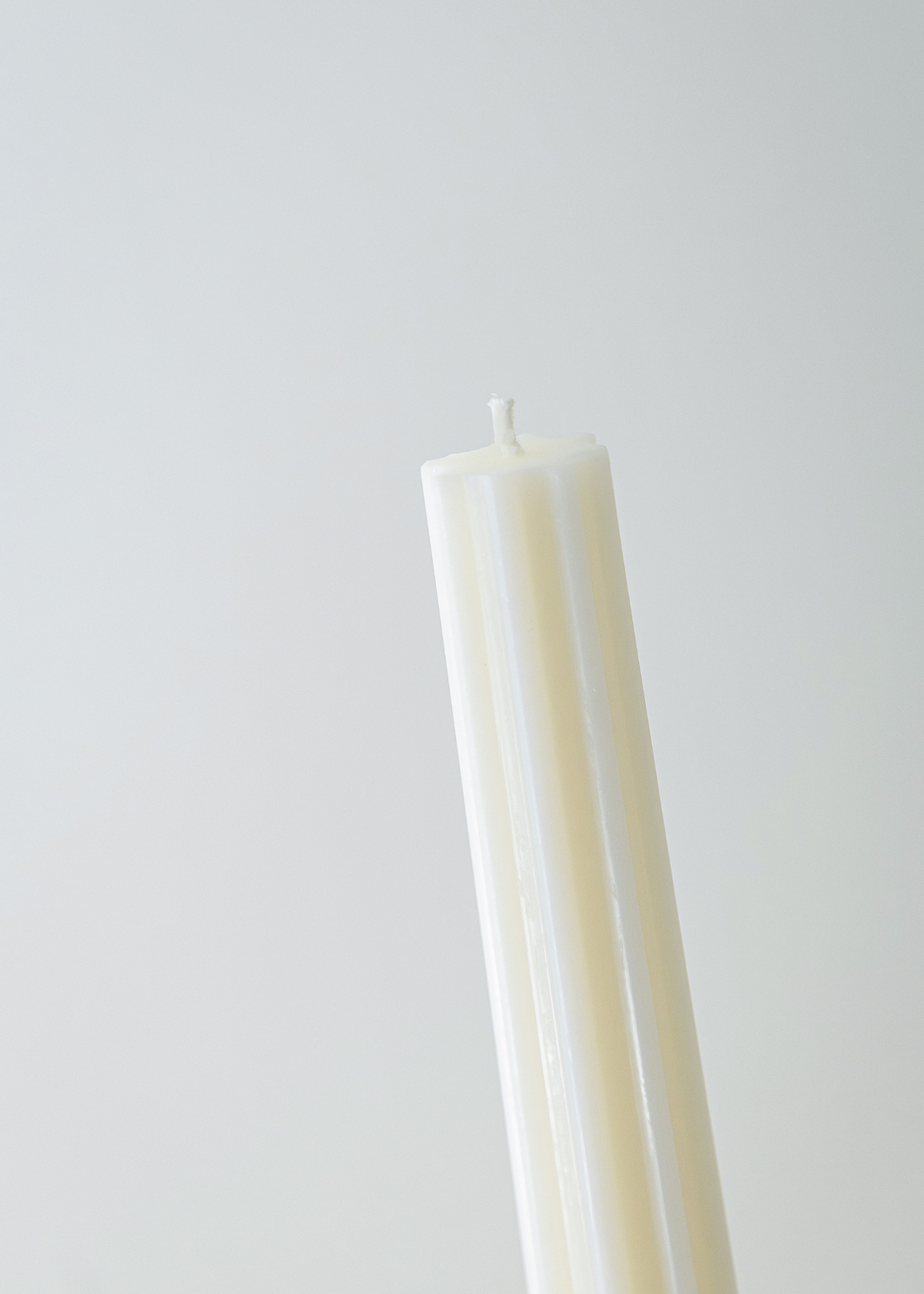 Incontro candle white soy and coconut wax candle with a ribbed design on a light background
