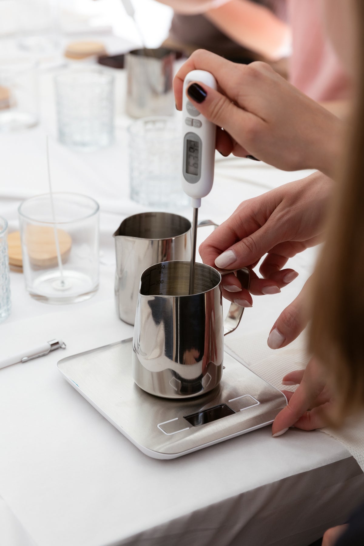 Create your candle Workshop hands using a white electric wax melter for a candle-making experience workshop ticket
